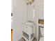 Bathroom features a white vanity with marble countertop, gray tiled floors, and classic fixtures at 5 Smith St, Charleston, SC 29401