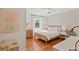 Stylish bedroom with light, natural wood accents, neutral tones, and a playful area at 5 Smith St, Charleston, SC 29401