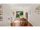Bright dining room with hardwood floors and sliding doors to a patio for seamless indoor-outdoor living at 5 Smith St, Charleston, SC 29401
