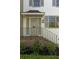 Close-up of the front entrance, showing brick steps, a black railing, and refined details at 5 Smith St, Charleston, SC 29401