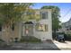 Inviting two-story home featuring neat landscaping, a paved walkway, and a designated parking spot at 5 Smith St, Charleston, SC 29401