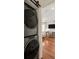 Laundry appliances are conveniently located near a bedroom and office, which can be seen from this vantage point at 5 Smith St, Charleston, SC 29401
