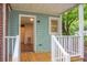 View of the back porch with a door leading into the home's living spaces at 5056 Piedmont Ave, North Charleston, SC 29406