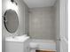 Cozy bathroom featuring a vanity with a round mirror and tiled shower and tub combo at 5056 Piedmont Ave, North Charleston, SC 29406