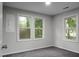 Bedroom with carpeting, natural light from several windows, and neutral-colored walls at 5056 Piedmont Ave, North Charleston, SC 29406