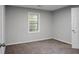 This bedroom offers new carpet and a window that provides great natural lighting at 5056 Piedmont Ave, North Charleston, SC 29406