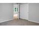 This bedroom features closet space with access to a room with updated floors at 5056 Piedmont Ave, North Charleston, SC 29406