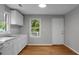 Bright kitchen featuring white cabinets, a modern countertop, and light wood flooring at 5056 Piedmont Ave, North Charleston, SC 29406