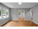 Living room with light wood flooring, neutral walls, and lots of natural light at 5056 Piedmont Ave, North Charleston, SC 29406