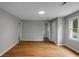 Spacious living room featuring light wood flooring, neutral walls, and ample natural light at 5056 Piedmont Ave, North Charleston, SC 29406