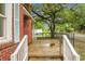 View of the front porch, showing concrete steps and a black iron fence at 5056 Piedmont Ave, North Charleston, SC 29406