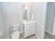 Bathroom with vanity, toilet, sink, and towel rack; offers natural light and storage space at 524 Richfield Way, Summerville, SC 29486