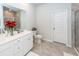 Elegant bathroom with double vanity, white cabinets, stylish tile, and a glass-enclosed shower at 524 Richfield Way, Summerville, SC 29486
