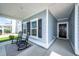 Inviting front porch with rocking chairs, tasteful decor, and a view of the home's exterior at 524 Richfield Way, Summerville, SC 29486