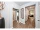 Bright hallway with wood-look floors, neutral walls, and doorways leading to various rooms at 524 Richfield Way, Summerville, SC 29486