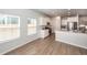 Open kitchen with stainless appliances, white cabinets, hardwood floors and natural light at 524 Richfield Way, Summerville, SC 29486