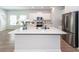 Stylish kitchen island with quartz countertops, stainless steel appliances, and ample seating at 524 Richfield Way, Summerville, SC 29486