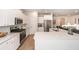 Modern kitchen with white cabinets, stainless steel appliances, and an open layout at 524 Richfield Way, Summerville, SC 29486