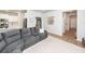 Comfortable living room space with a gray sectional, neutral rug, and open access to other areas at 524 Richfield Way, Summerville, SC 29486
