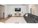 Well-lit living room with a comfortable sofa, modern decor, and a spacious, inviting ambiance at 524 Richfield Way, Summerville, SC 29486