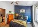 Charming bedroom featuring a navy accent wall, and a dresser at 525 Tayrn Dr, Wando, SC 29492