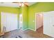 Large bedroom with ceiling fan, adjoining bathroom, carpet, and closet at 525 Tayrn Dr, Wando, SC 29492