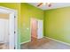 Bedroom featuring green-painted walls and two doorways with natural light at 525 Tayrn Dr, Wando, SC 29492