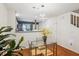 Dining area with glass table and view to open kitchen at 525 Tayrn Dr, Wando, SC 29492