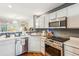 Bright and modern kitchen with stainless steel appliances and open layout at 525 Tayrn Dr, Wando, SC 29492