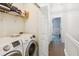 Laundry room with new, front-loading washer and dryer, plus wire shelving at 525 Tayrn Dr, Wando, SC 29492