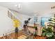 Open-concept living and dining area with a modern chandelier, staircase, and lots of natural light at 525 Tayrn Dr, Wando, SC 29492