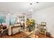 Inviting living room featuring a glass dining table set, stylish decor, and access to the outdoor space at 525 Tayrn Dr, Wando, SC 29492