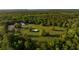 Expansive horse property featuring paddocks, stables and a barn nestled among mature trees at 5348 Mccullough Dam Rd, Wadmalaw Island, SC 29487