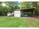 View of a spacious barn with covered parking area, featuring ample space for vehicles and equipment at 5348 Mccullough Dam Rd, Wadmalaw Island, SC 29487