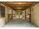 Inside a barn, a gated entrance provides security, with an open view of the grounds for animal comfort at 5348 Mccullough Dam Rd, Wadmalaw Island, SC 29487