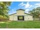 Daytime shot of a barn with wide sliding doors, showcasing its functionality and traditional charm at 5348 Mccullough Dam Rd, Wadmalaw Island, SC 29487