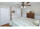 Charming bedroom showcases a four-poster bed, ceiling fan, and classic decor at 5348 Mccullough Dam Rd, Wadmalaw Island, SC 29487