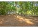 Inviting home nestled among mature trees with lush greenery, offering a serene and private setting at 5348 Mccullough Dam Rd, Wadmalaw Island, SC 29487