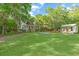 Expansive property showcasing the main house, guest house, and lush green lawn, ideal for outdoor activities at 5348 Mccullough Dam Rd, Wadmalaw Island, SC 29487
