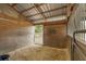 Interior of a horse stall featuring wooden walls, ample natural light, and a secure space for livestock at 5348 Mccullough Dam Rd, Wadmalaw Island, SC 29487