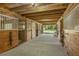 Aisles of well-constructed horse stalls with durable wood framing and secure metal gating for animal comfort at 5348 Mccullough Dam Rd, Wadmalaw Island, SC 29487