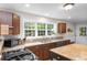Bright kitchen with updated appliances, granite countertops, and a large window with a backyard view at 5348 Mccullough Dam Rd, Wadmalaw Island, SC 29487