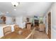 Spacious living area with fireplace, leather furniture, and seamless transition to the dining area at 5348 Mccullough Dam Rd, Wadmalaw Island, SC 29487