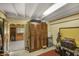 Interior view of barn storage area, featuring storage lockers, mini fridge, and ample space for equipment at 5348 Mccullough Dam Rd, Wadmalaw Island, SC 29487