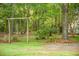 Spacious yard featuring mature trees and lush greenery, creating a private and tranquil outdoor space at 5348 Mccullough Dam Rd, Wadmalaw Island, SC 29487