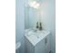 Bright bathroom with a white vanity, toilet, and white countertops and under-cabinetry at 602 Twin Rivers Dr, Wando, SC 29492