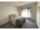 Comfortable bedroom featuring a plush bed, and a bright window at 7517 Whispering Oak Dr, Hanahan, SC 29410
