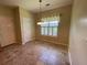 Cozy breakfast nook with tiled flooring, a window, and a view to the kitchen at 7517 Whispering Oak Dr, Hanahan, SC 29410