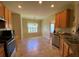 Bright breakfast nook featuring tiled floors, a window, and views of the kitchen at 7517 Whispering Oak Dr, Hanahan, SC 29410