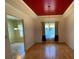 Elegant dining room with tray ceiling, hardwood floors, and decorative chandelier at 7517 Whispering Oak Dr, Hanahan, SC 29410